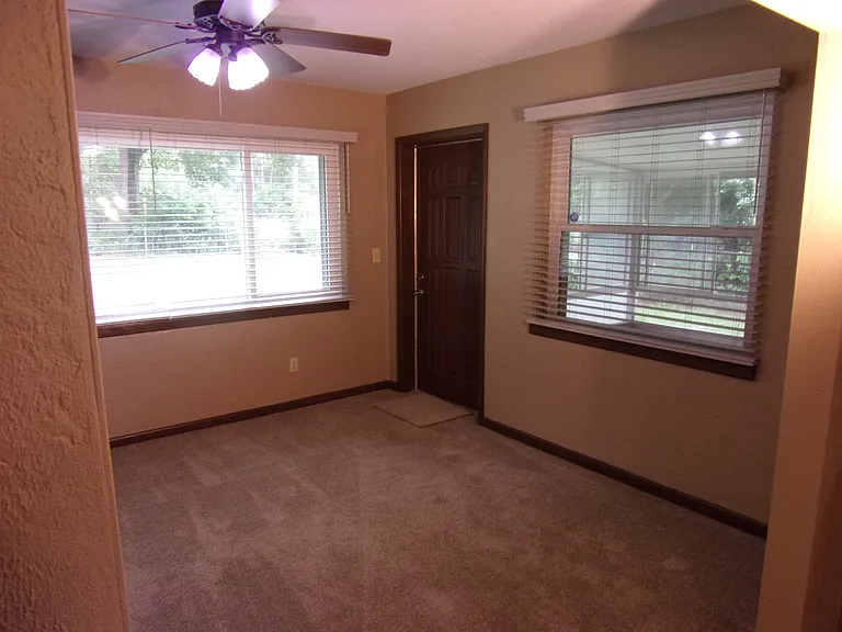 SUN ROOM WITH LARGE WINDOWS OVERLOOKING BACKYARD - NEW WOOD-LIKE BLINDS