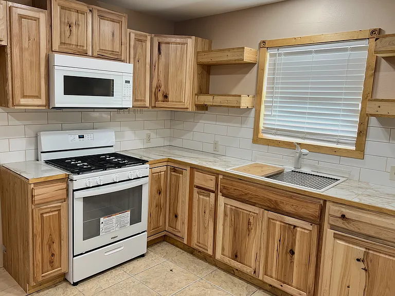 Gorgeous countertops and wood cabinets!
