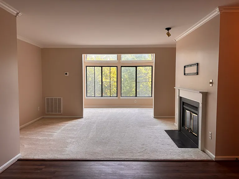 Spacious living area with wood burning fireplace