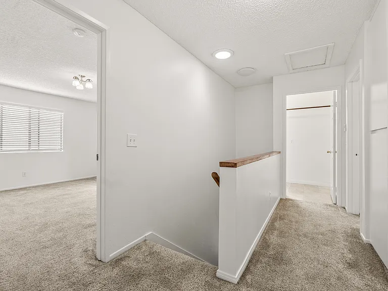 Top of stairs that leads to master bedrm, bedrm 2, bedroom 3 and laundry room