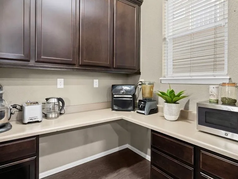 Nook next to kitchen for extra counter space and kitchen storage