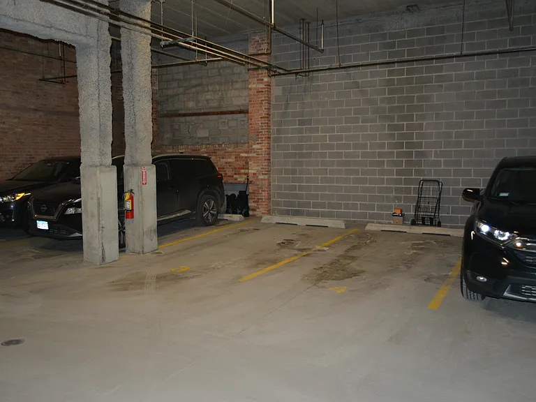 Secure, heated, indoor garage parking spot U3 included in rent