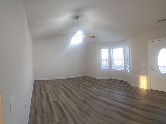 Front Room with Vaulted Ceiling and Bay Window