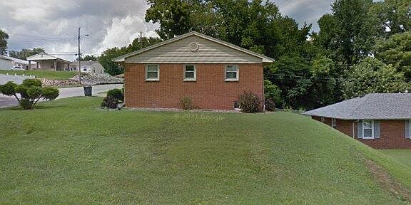 Side view of home shows large grass area, top of a hill, corner lot :)