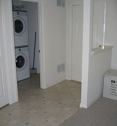 entrance with high efficiency washer dryer in side closet