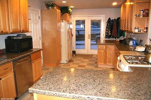 Huge bright kitchen with yards and yards of counter space and maple cabinets