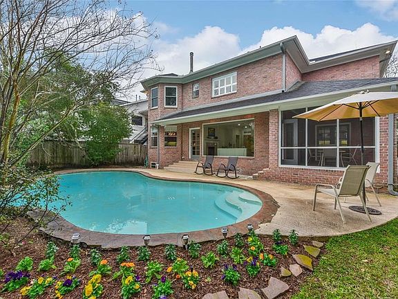 Get the most out of these hot Houston summers with this functional backyard equipped with a lovely pool.