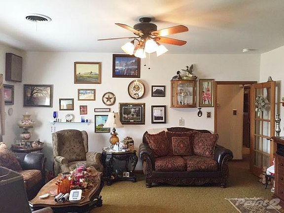 THERE ARE HARDWOOD FLOORS LOCATED UNDER THE CARPET.