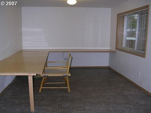 First floor bonus room has a built-in desk that can be removed for painting.