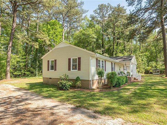 Side view with driveway which provides plenty of space for parking.