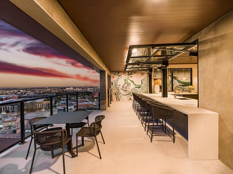Rooftop bar seating with skyline views, offering a relaxed setting for evenings and gatherings at Modera St. Paul.