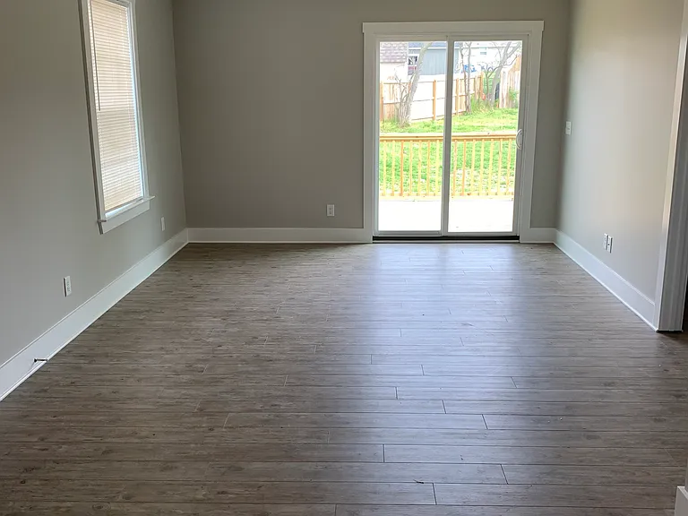 Living room with door to deck