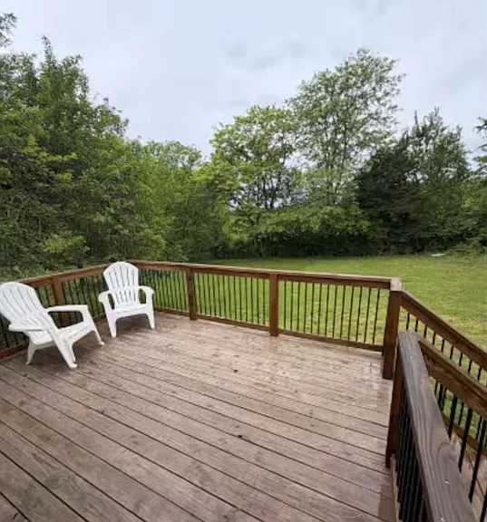 Private deck overlooking shaded backyard