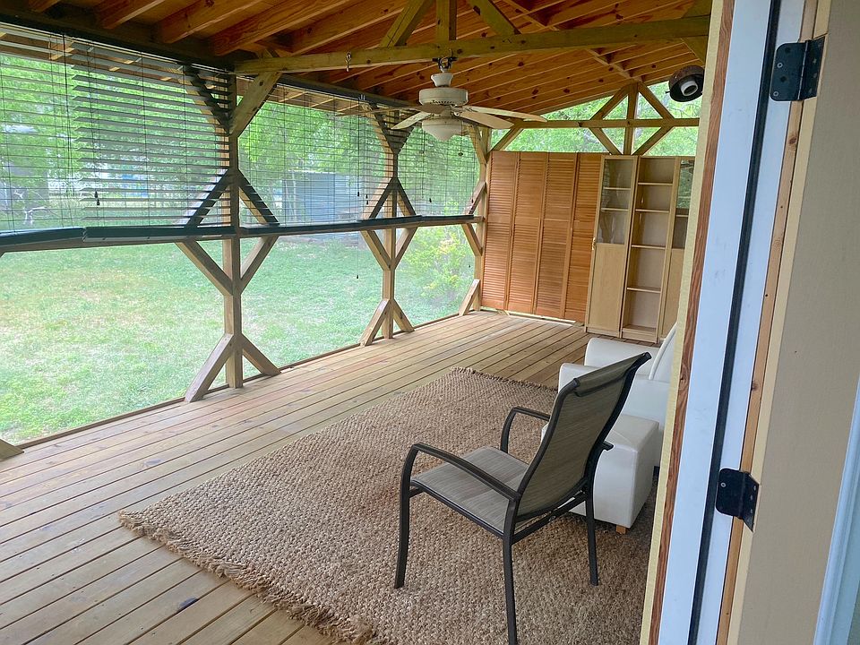 Relaxing screened-in deck with additional living space
