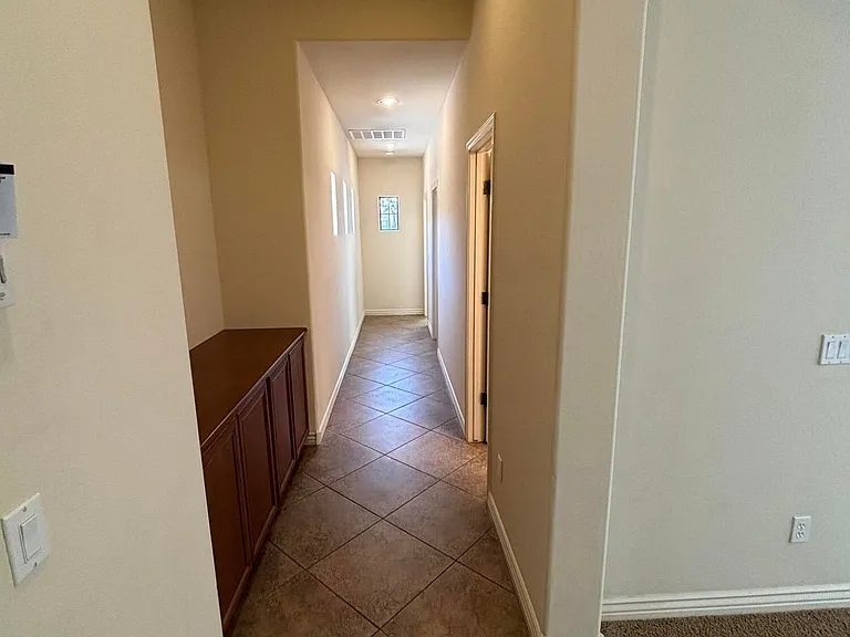 HALLWAY WITH BUILT IN CABINETS.