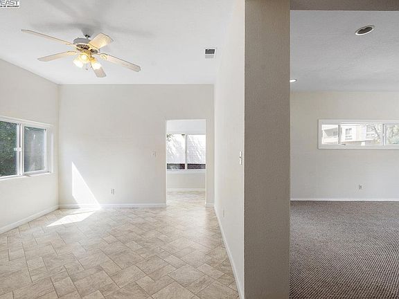 Straight ahead you'll see the entrance to the sunroom off the kitchen