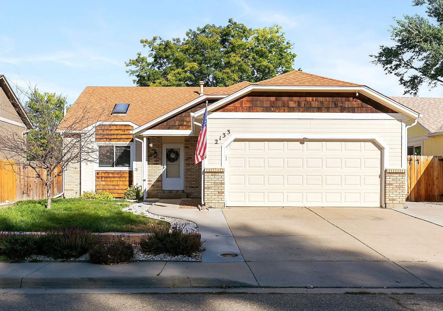 Split-Level Loveland Home with Updated Kitchen, Fenced Yard & Central AC — Photo 1