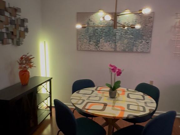 dining area with updated light fixture