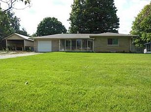 Exterior Front. Beautiful Bedford stone ranch in desirable Warren Township, close to shopping, highways, and schools! Features a nice glass enclosed porch, newer vinyl windows, and over a half an acre of land.