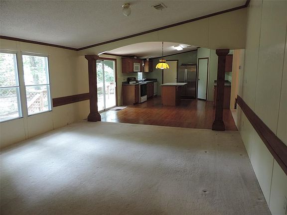 View of Den into dining and kitchen.