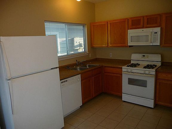 Kitchen has a back door to the detached garage.