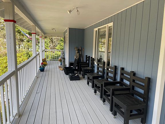 Western street view from the front of the house on the wraparound deck.