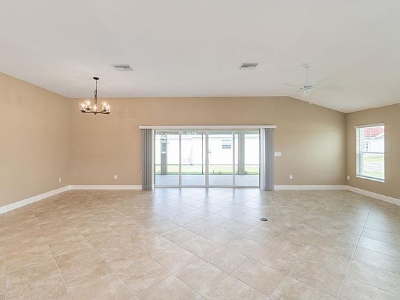 Large Great room with sliding stacking doors onto extended lanai