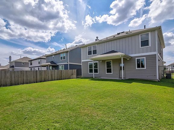 Expansive backyard ideal for entertaining, outdoor dining, or simply enjoying the open space.