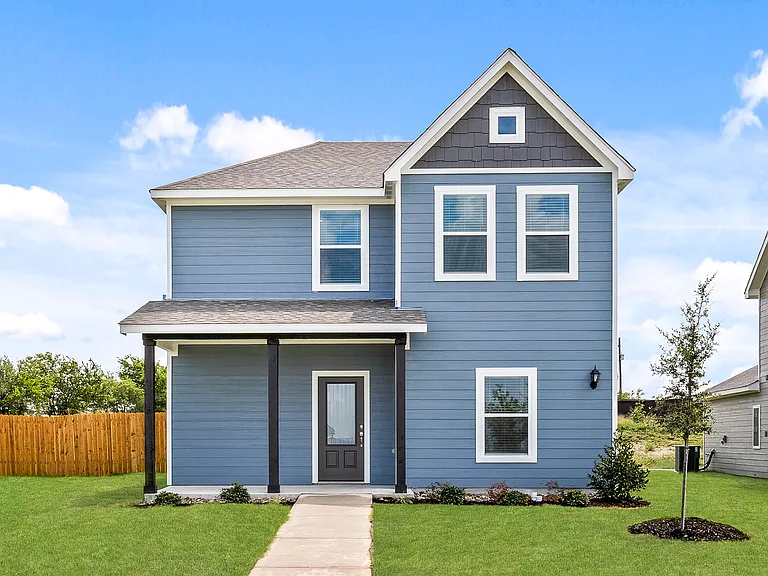 The Dogwood is a beautiful two-story home with an attached two-car garage and front porch.