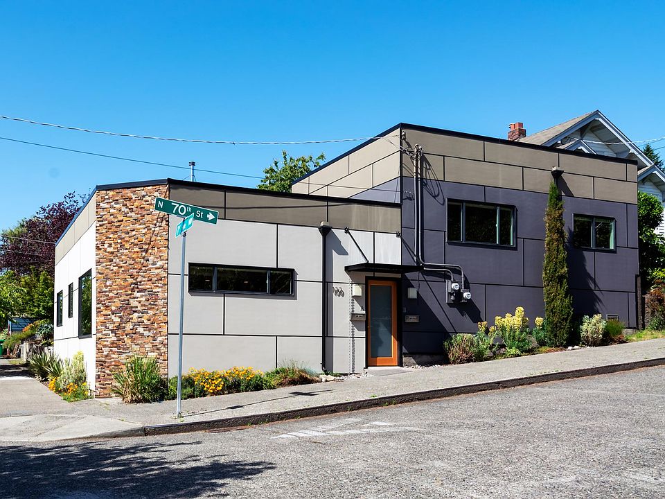 Exterior view of duplex. Unit A is white section on left.