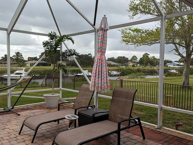 Loungers, drink table, hammock and umbrella will remain for your enjoyment.