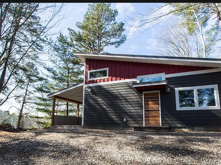 Front door. Not shown in photo: left side covered porch has door and railing.