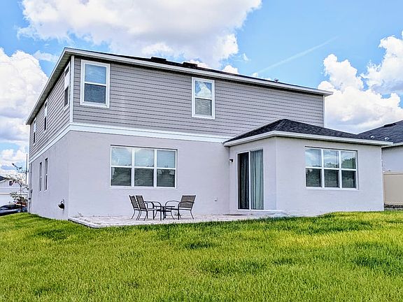Backyard patio with partial fencing