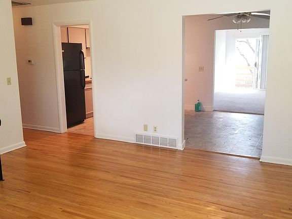 Living area looking into kitchen and eating area.