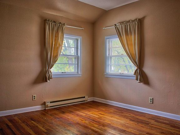 Bedroom with hardwood floors.