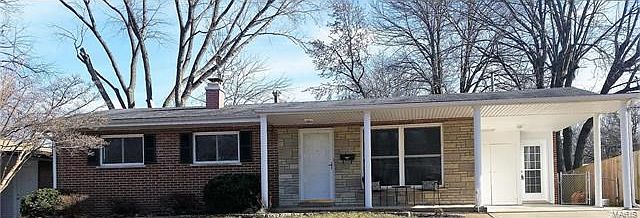 Brick and stone facade.  Family-friendly front porch.  Covered parking plus double-wide driveway.