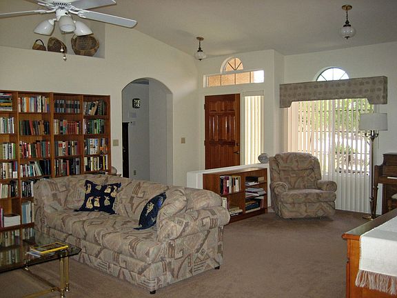 Front entry into great room,vaulted ceilings,arch windows,fans               