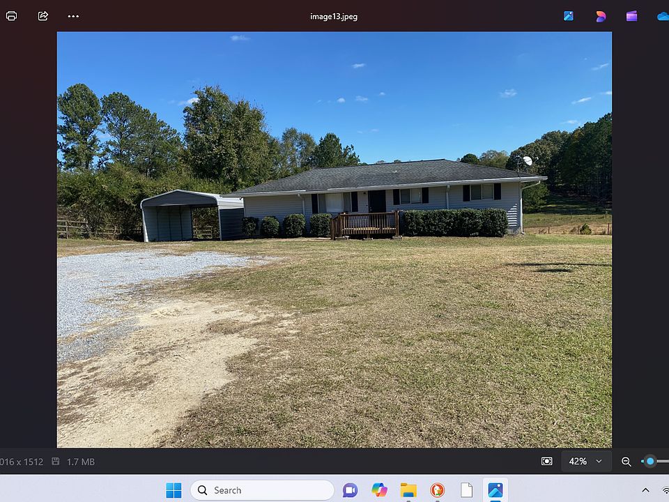 House with detached carport and large yard