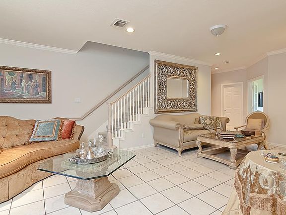 LIVING ROOM IS ON THE SECOND FLOOR  WITH TILE THROUGHOUT