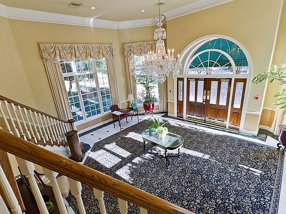 ENTRY FOYER IS SUNNY AND WELCOMING