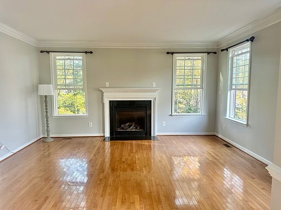 Sitting room with fireplace by entry