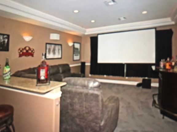 Screen retracts in ceiling