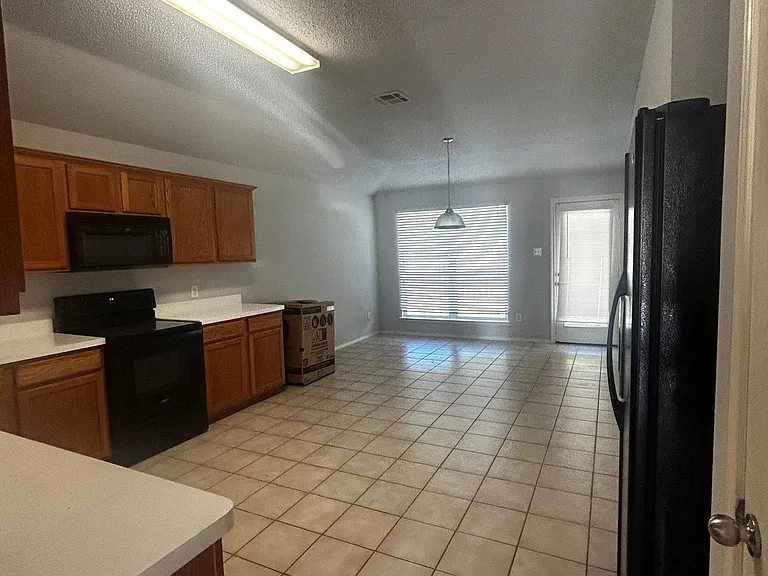 kitchen with windows facing backyard