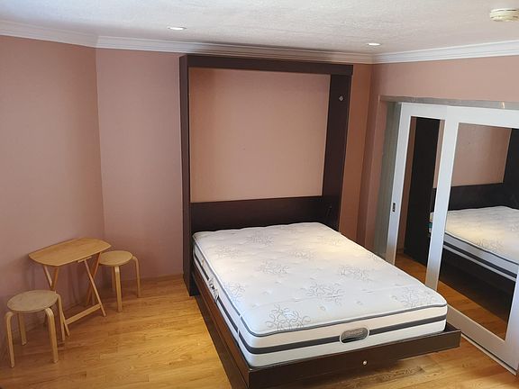 Junior bedroom with queen sized Murphy bed (retracts up to wall)