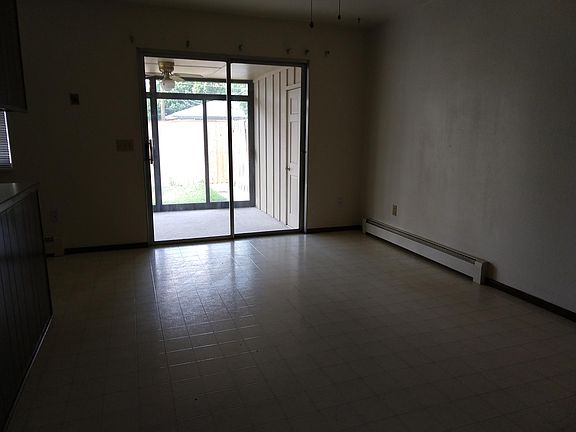 Dining area with patio door access to enclosed patio.