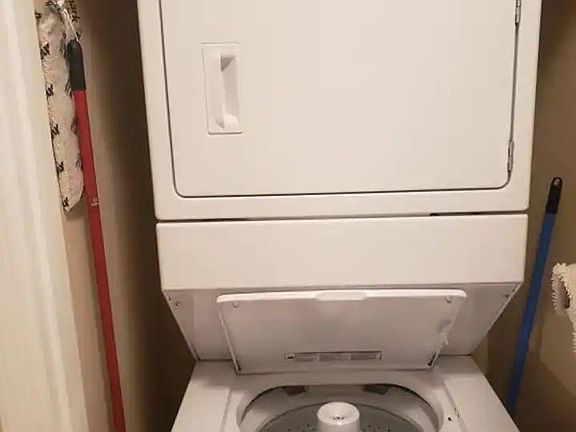 Stackable washer and Dryer in the unit next to the master bedroom .