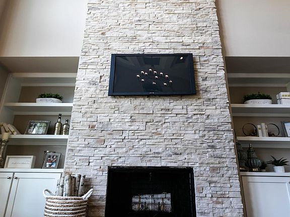 2 story stone fireplace