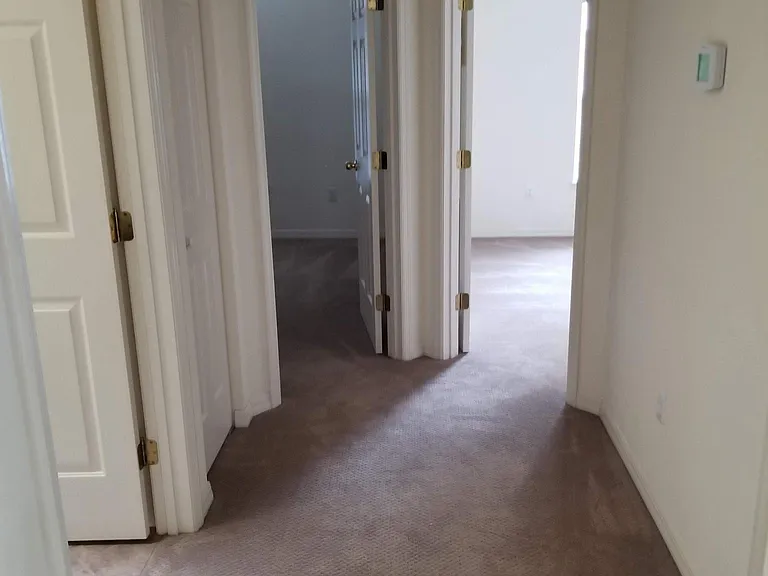 hall way leading to Guest bathroom, Guest bed room, garage,