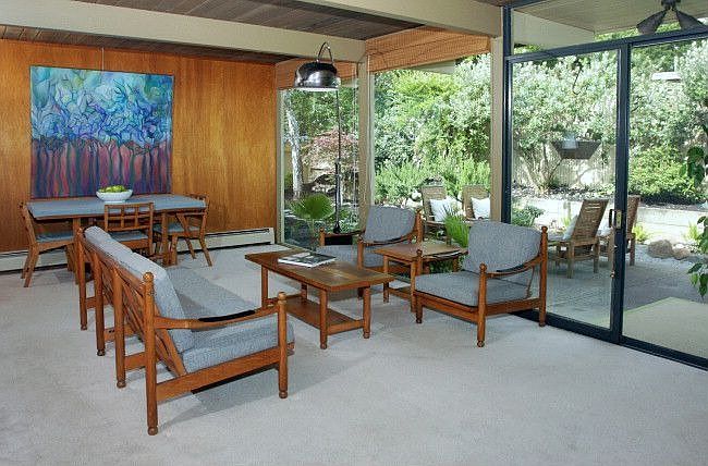 Dining Area/Living Room has stunning floor to ceiling walls of glass. 