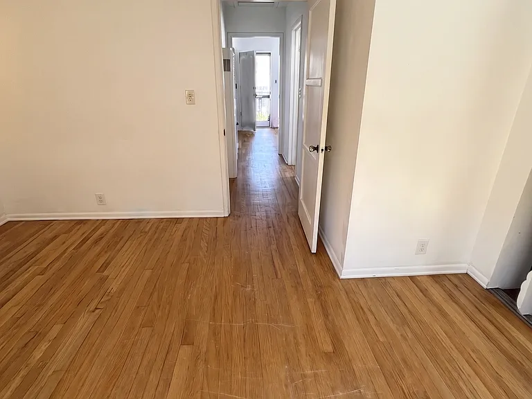 view from master bedroom hallway to living room